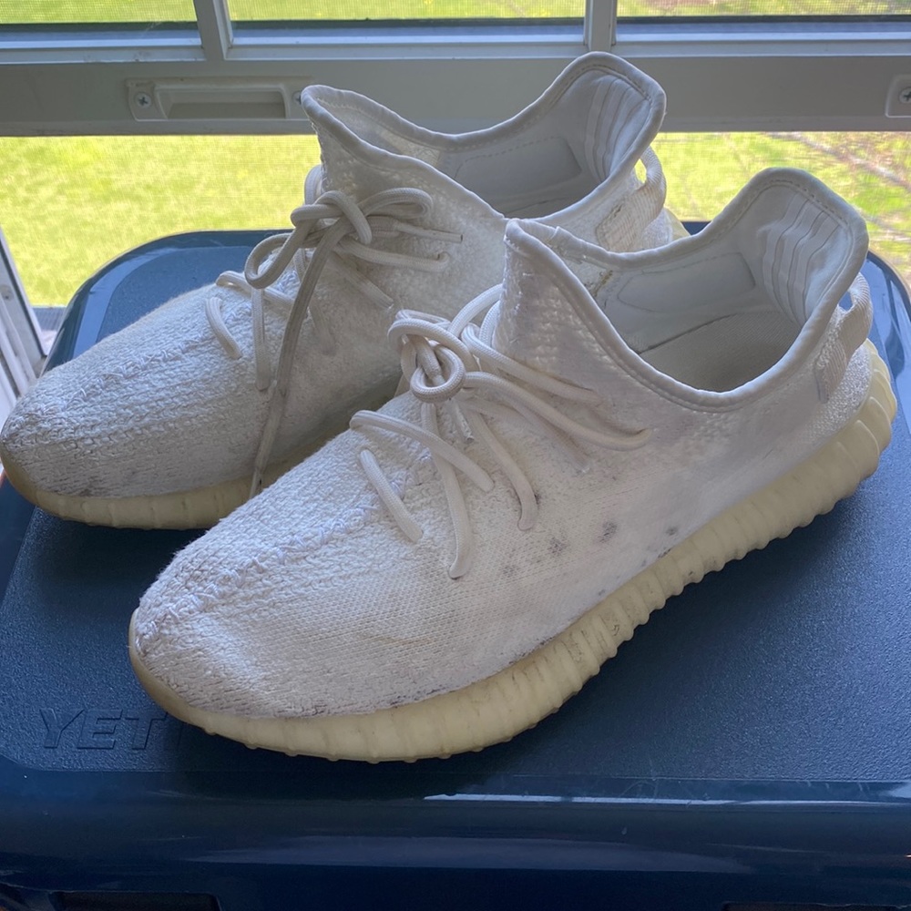 Cream/triple white Yeezy boost V2s.